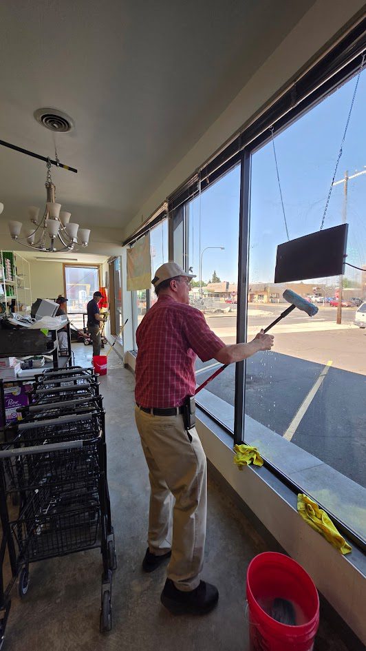 A member of the 226 Men working on the windows in the building materials section of the ReStore